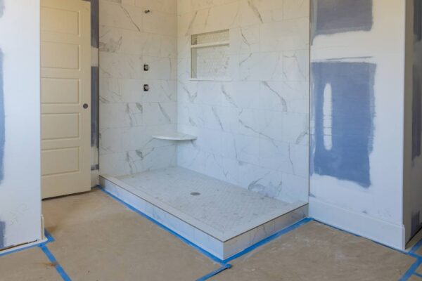 bathroom being taped for repainting